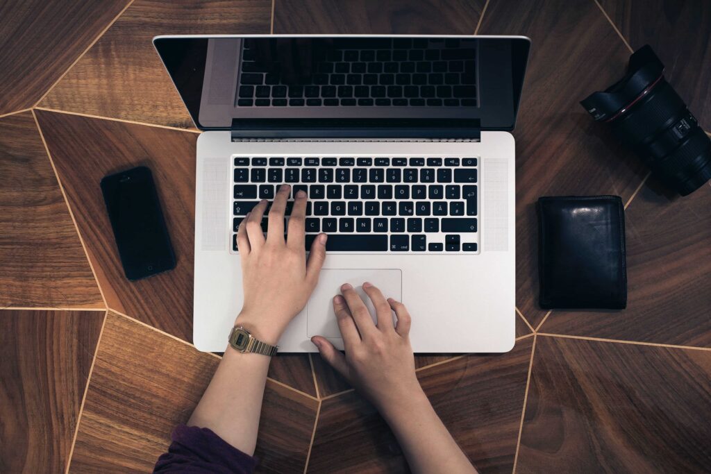 man typing on a computer