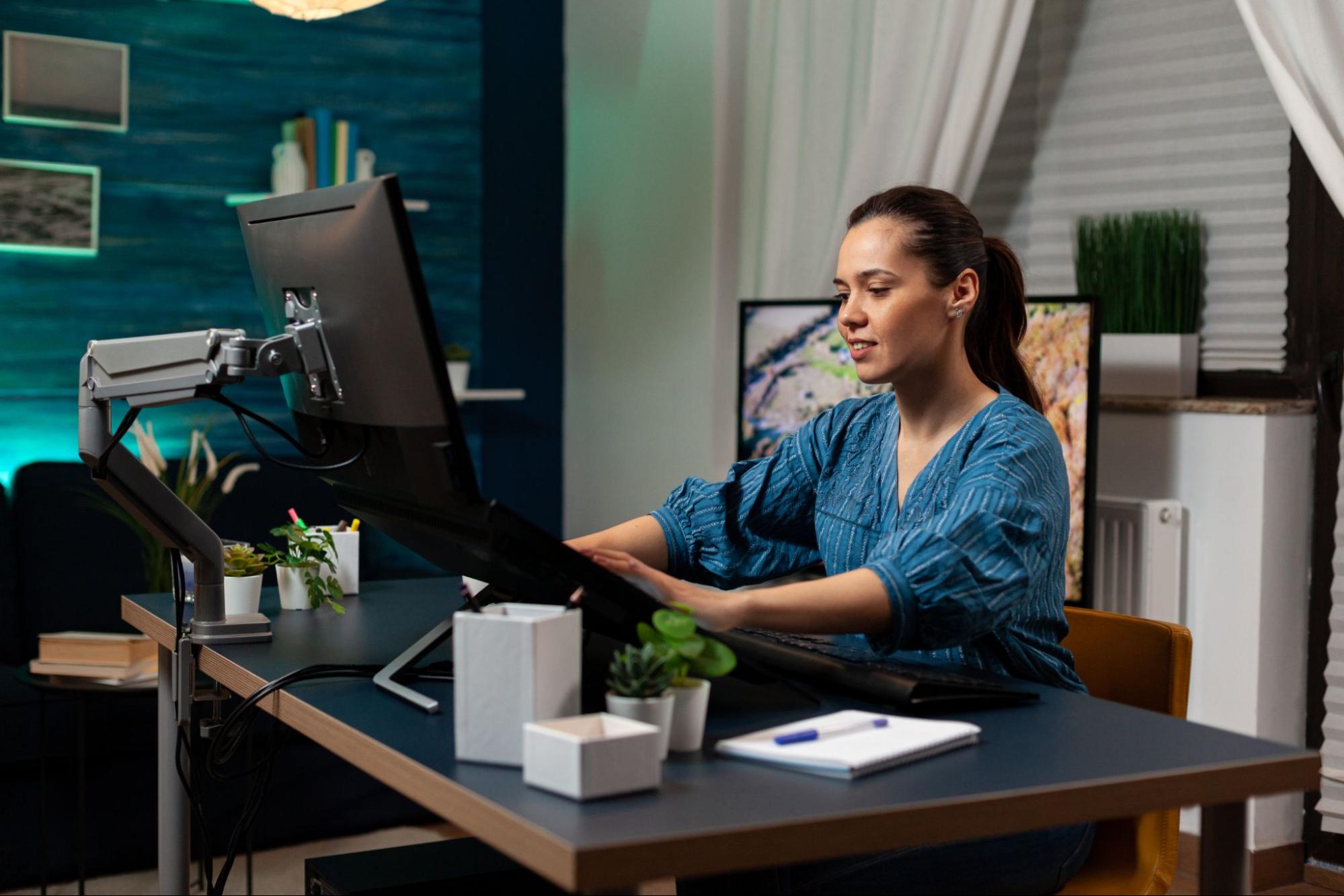 Woman in an office working at a computer