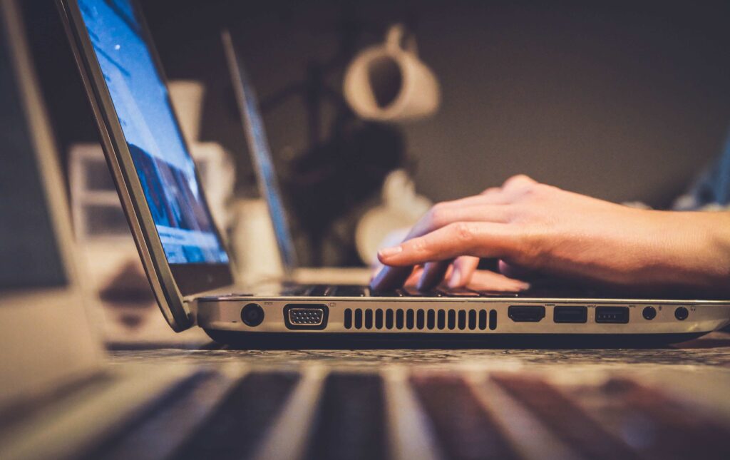 person typing on a computer