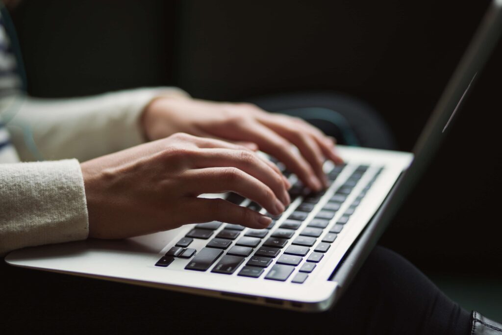 man typing on a computer