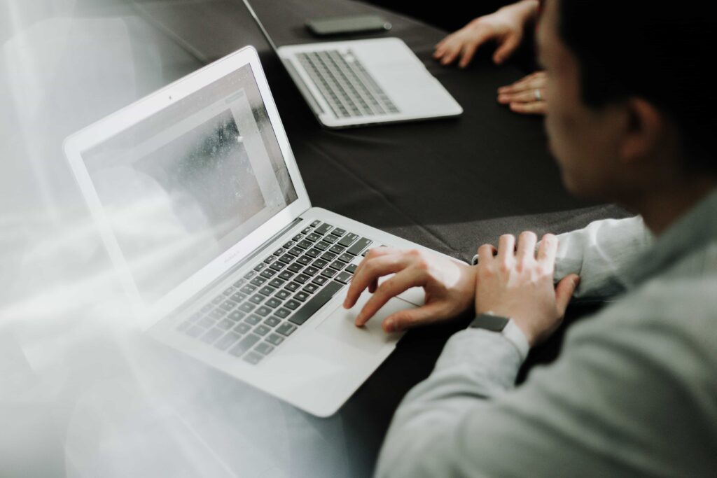 man typing on a computer