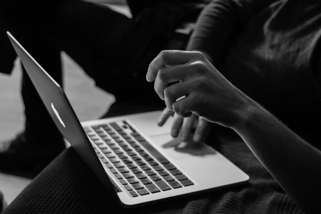 man typing on a computer